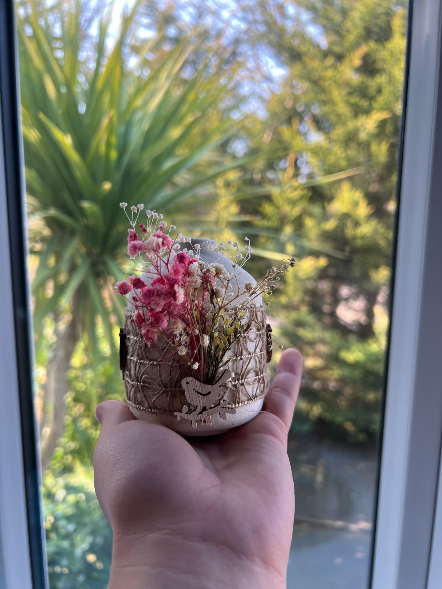 Decorative Ceramic Vase with Dried Flowers and Wooden Bird Accent