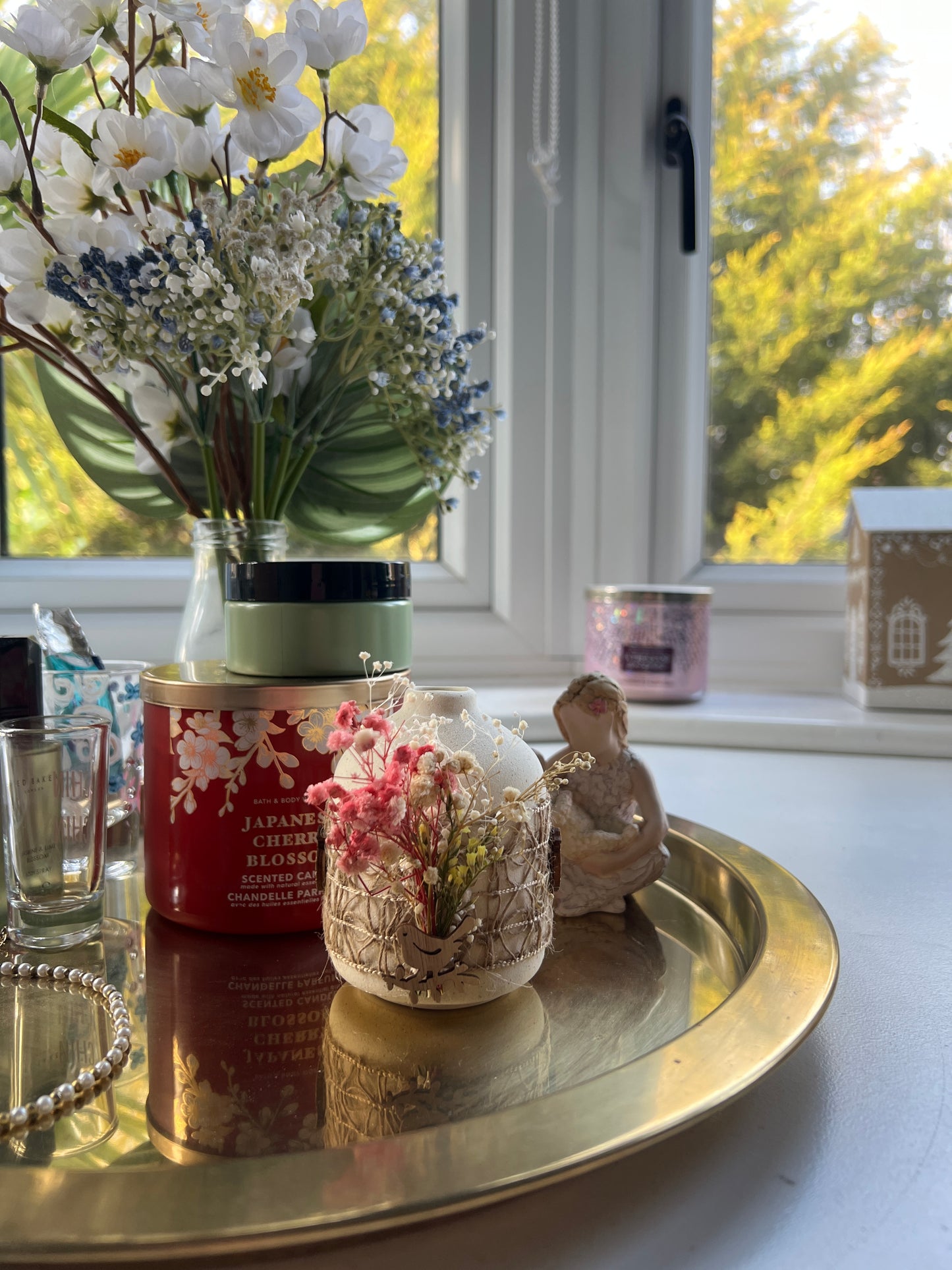 Decorative Ceramic Vase with Dried Flowers and Wooden Bird Accent